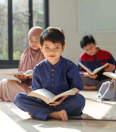 a-cute-little-boy-smiling-at-camera-after-reading-2023-11-27-04-54-18-utc